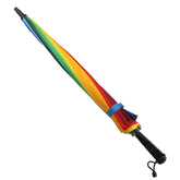 A vibrant Rainbow Colour Umbrellar ready for use, showcasing its colorful design and sturdy handle.